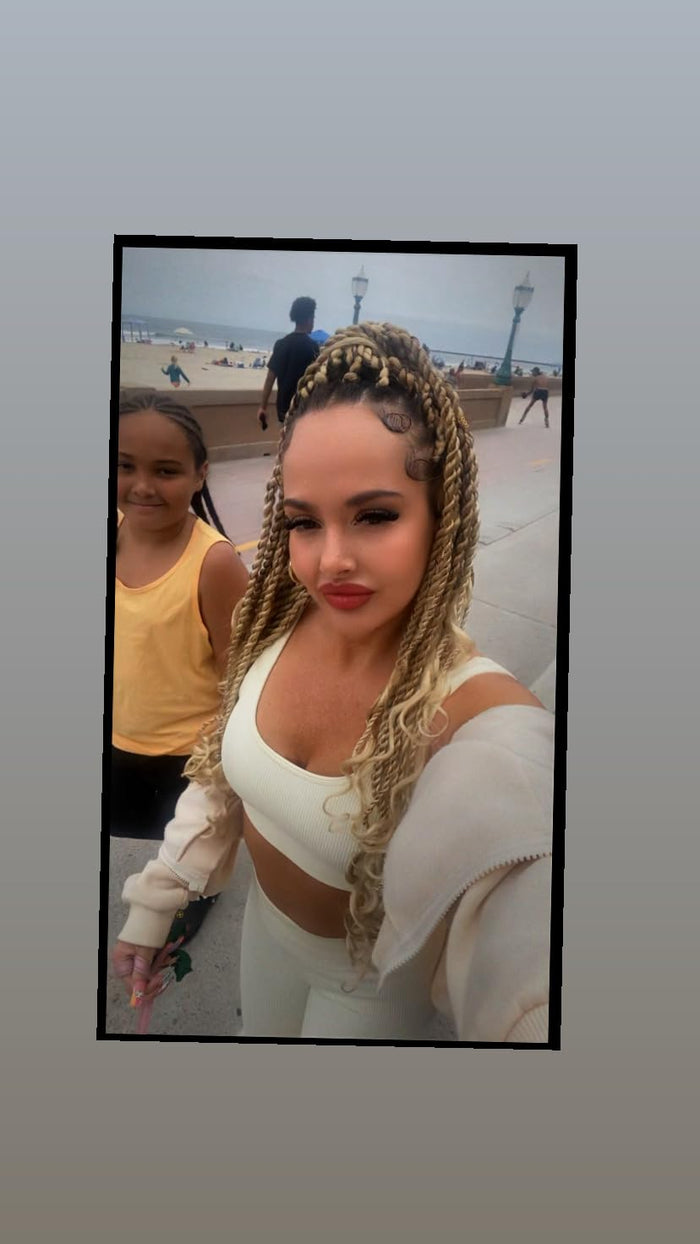 Customer photo outdoors near beach showing yellow tank top
