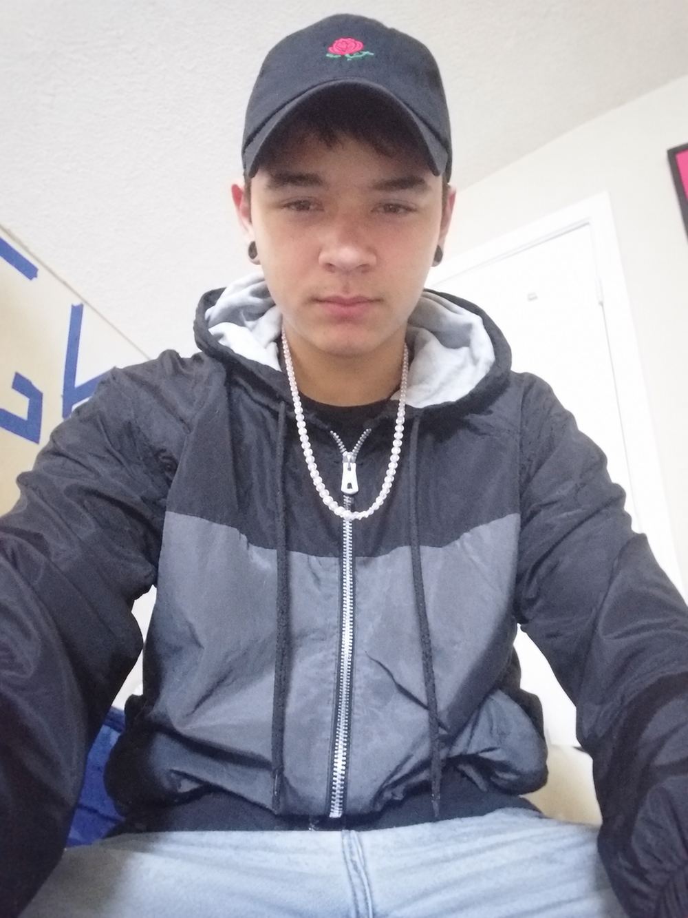 Noah W. wearing gray and black zip-up windbreaker, upright portrait